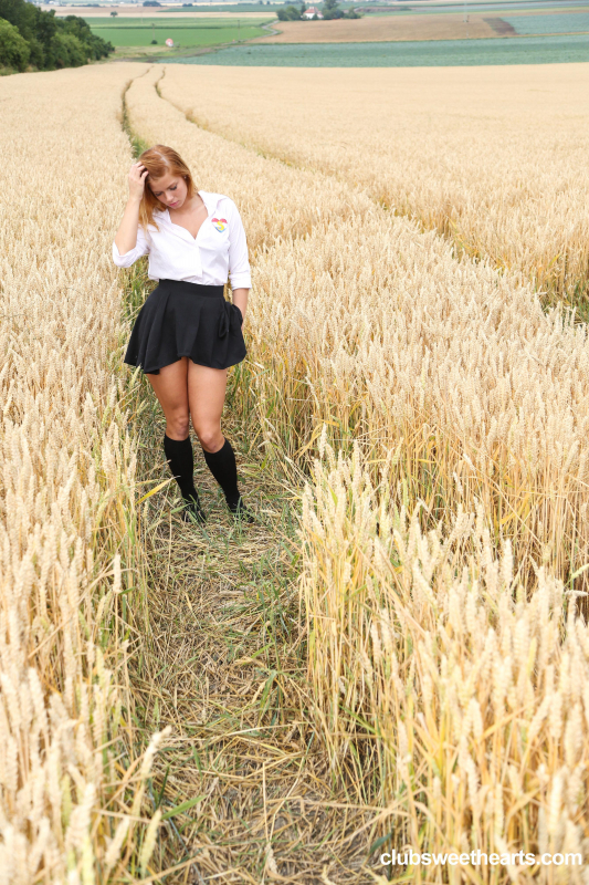 Schoolgirl pleasuring herself in a wheat field