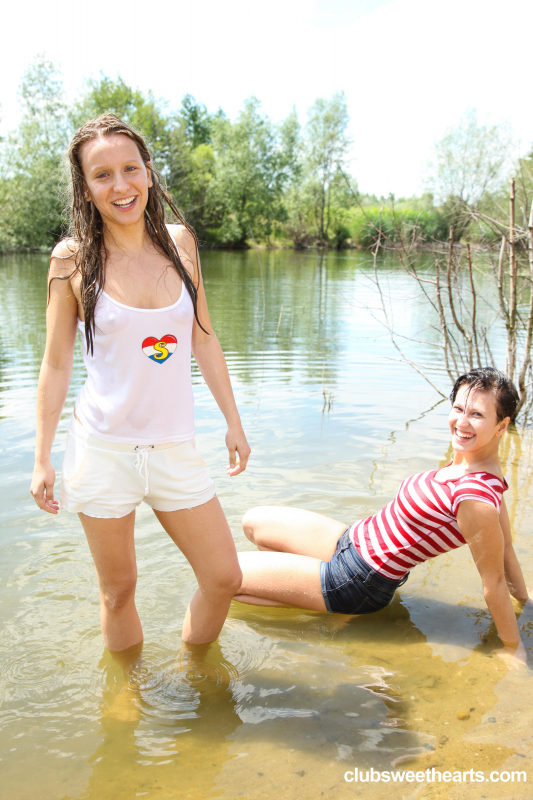 Teens playing with each other by the lake