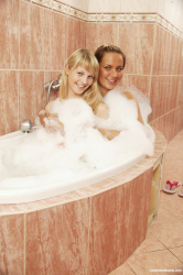 Two-delicious-blondes-having-dildo-fun-in-the-bath