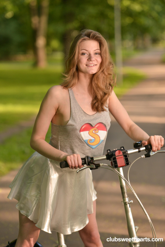 Cam girl Merry Pie riding her bike without panties