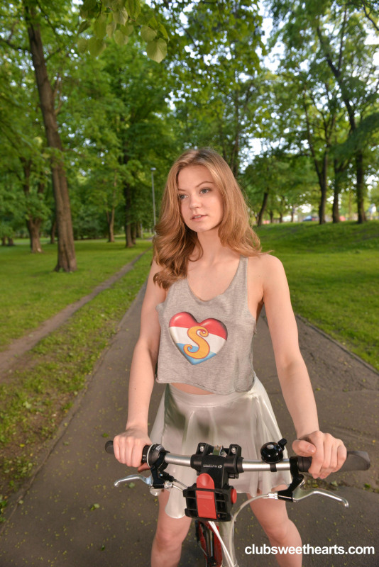 Cam girl Merry Pie riding her bike without panties