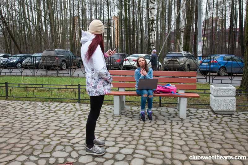 Young girls toying each other