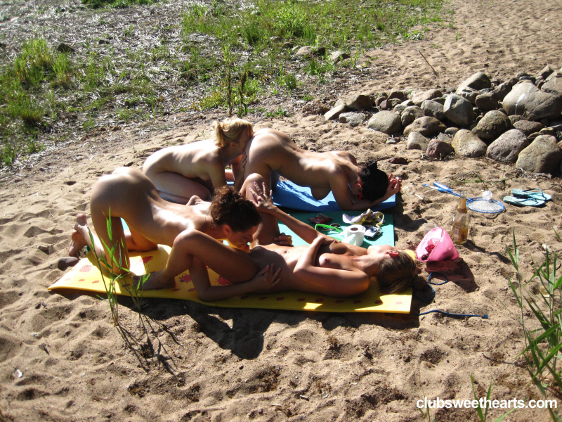 Sweet lesbians making out on the beach