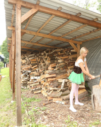 Cayla cutting wood and rubbing pussy