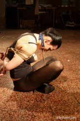 Mindy-tied-bitgagged-on-the-floor